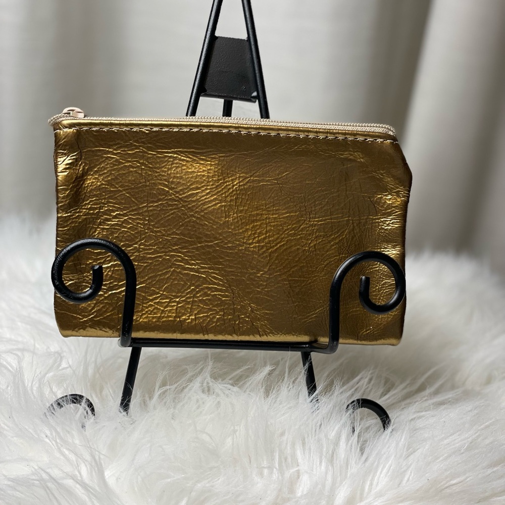 Chic Metallic Soft Gold Leather Bag with Zipper Closure adding a Touch of Glam